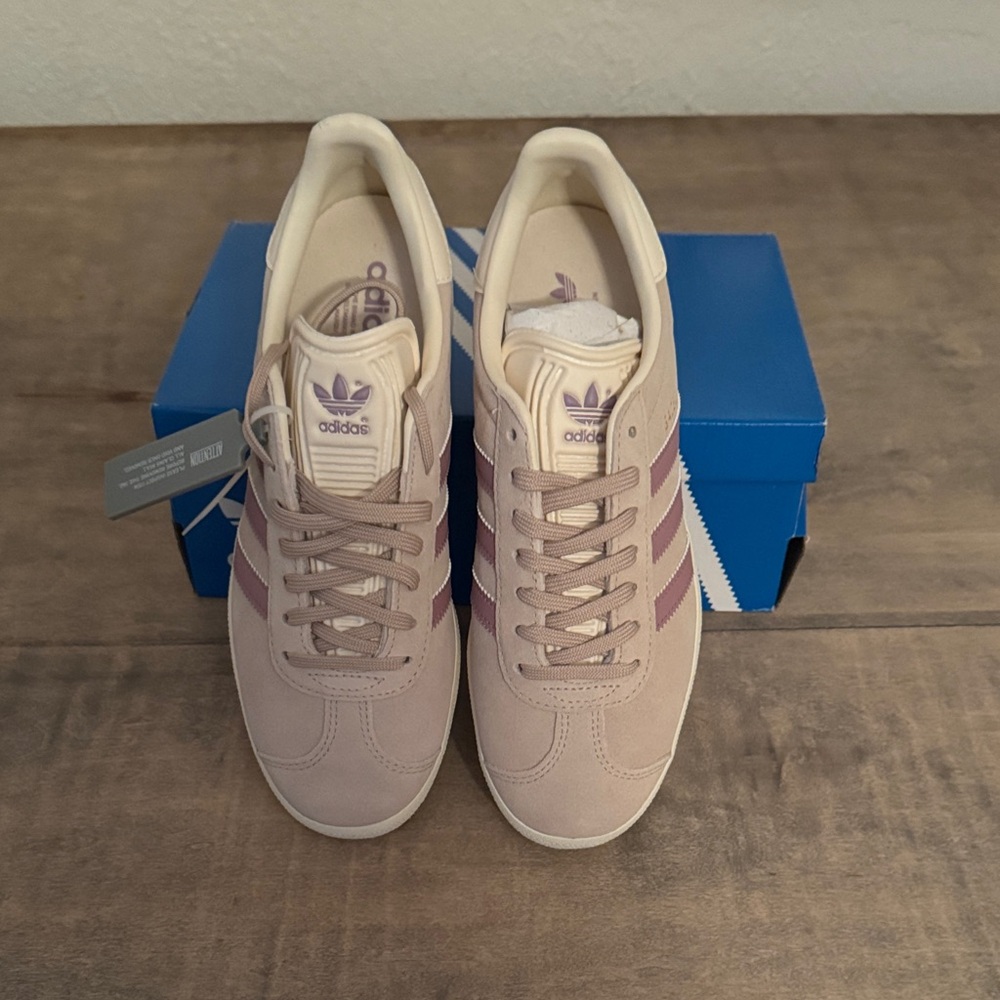 Women’s Adidas Gazelle’s Sneakers with Purple Stripes. Color is called Wontau.